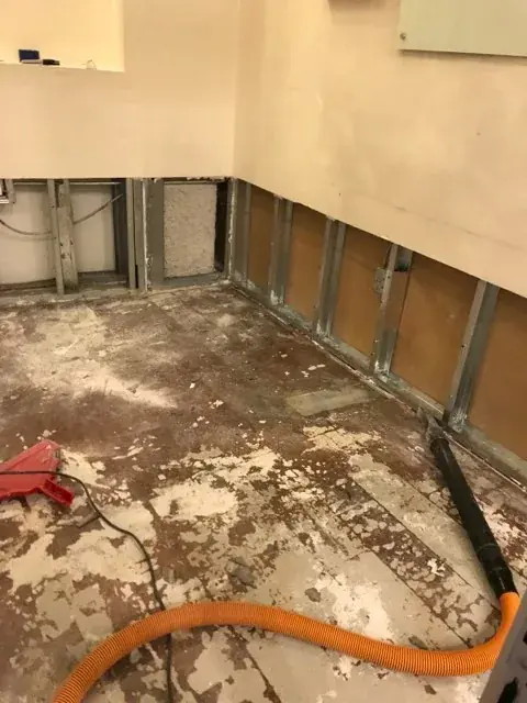 Roof and ice dam leak water damage being dried in a Derry, NH home